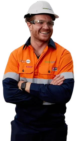 Snowy hydro scheme with worker in the foreground